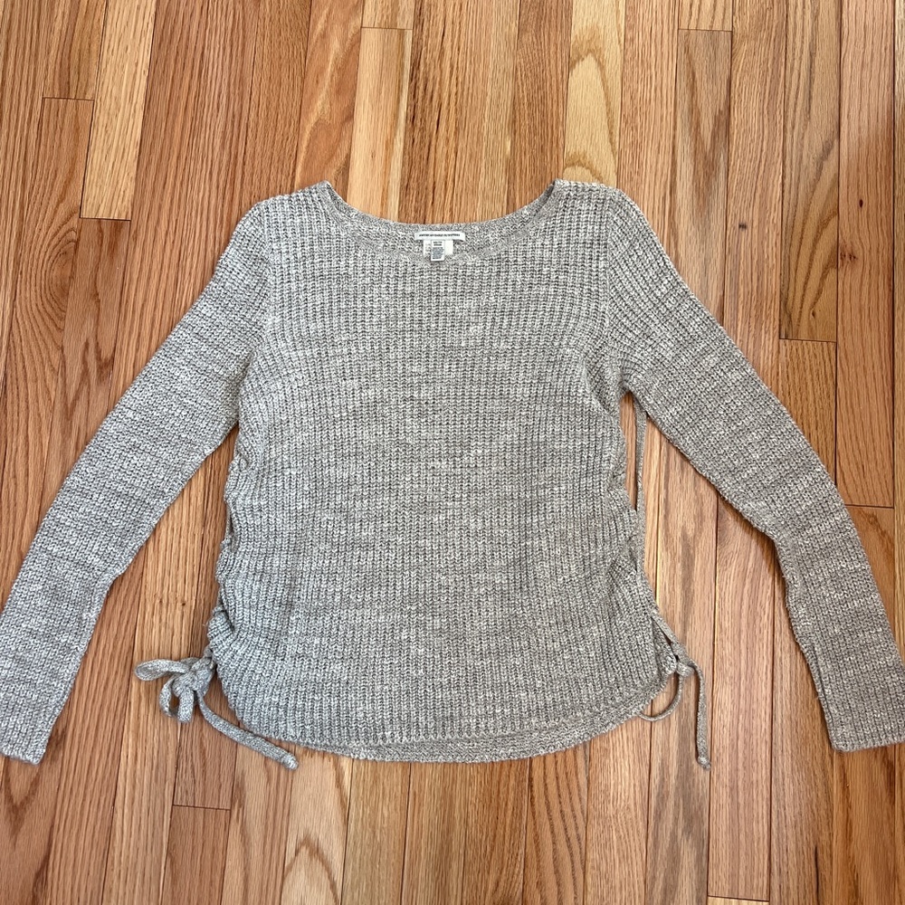 Gray American Eagle sweater with tie details on the side